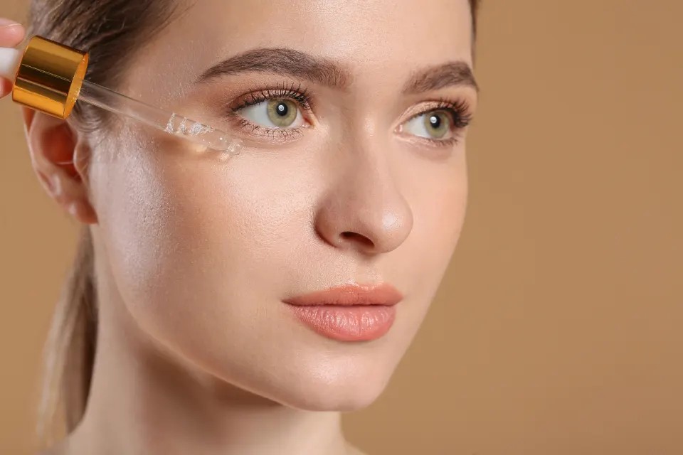 Skincare serum being applied with a dropper